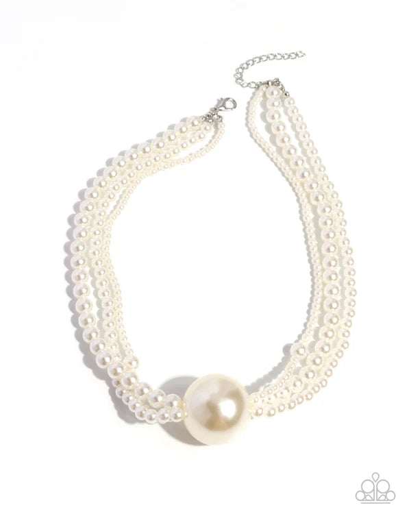 Pearl necklace with a large central pearl on a white background