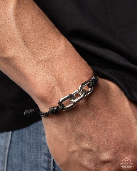 Illustrious Industry Silver Paparazzi bracelet with thick silver links and layered black cord