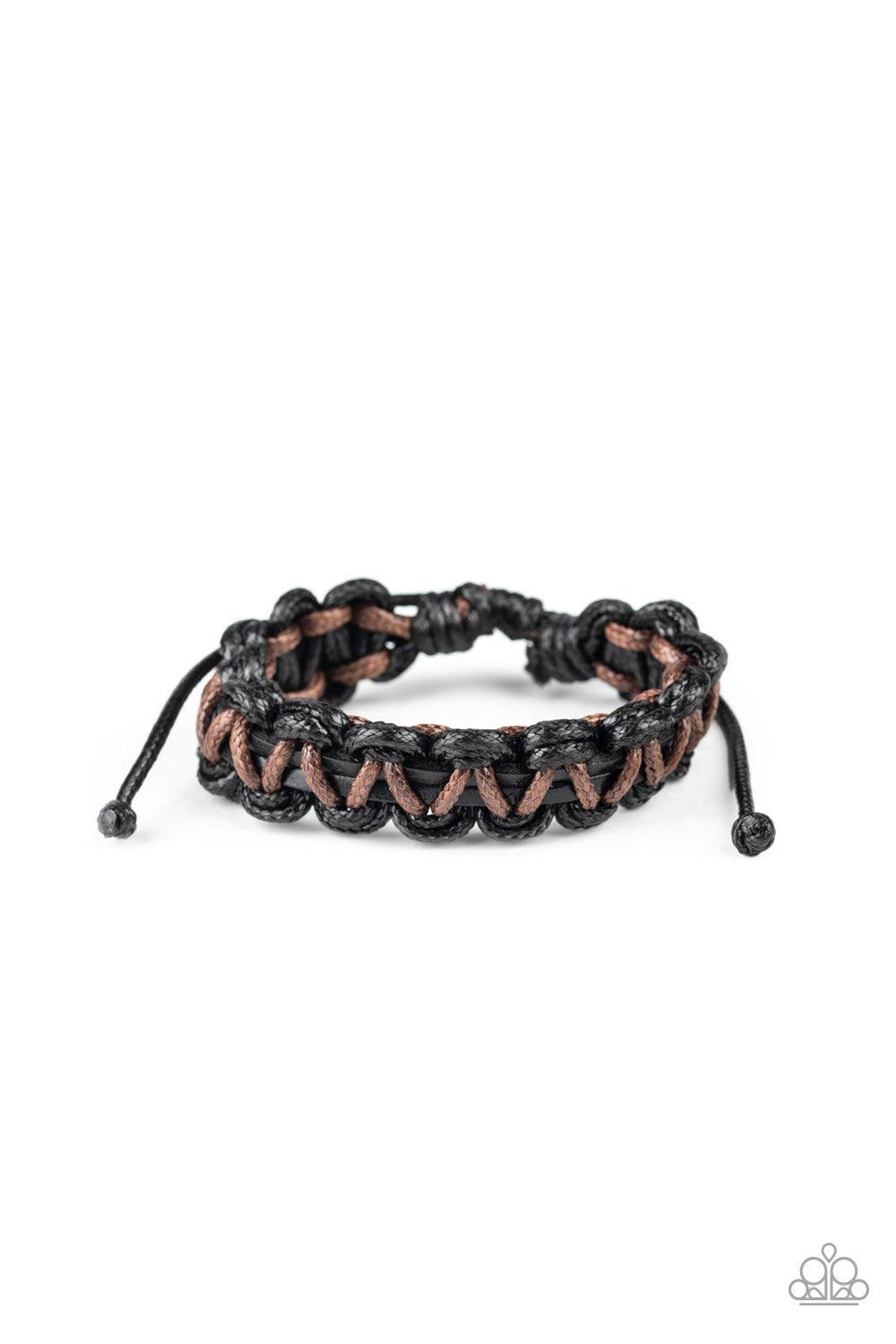 brown and black cording ornately weave around black leather cords