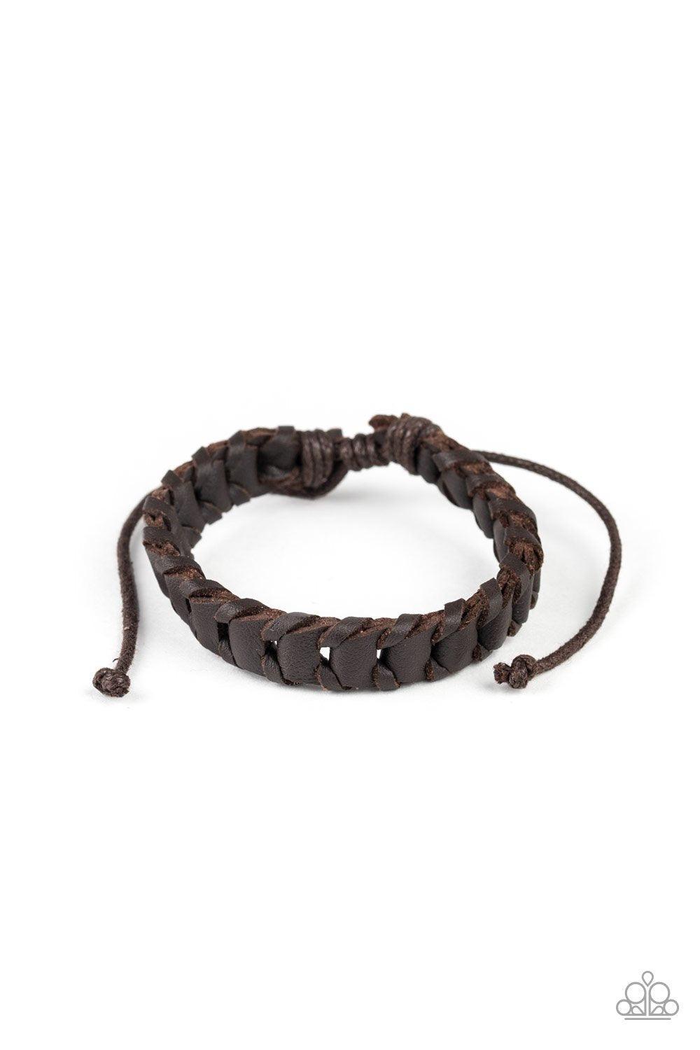 Grit and Grease - Brown Item #P9UR-BNXX-460XX Shiny brown cording threads through the center of a brown leather band, creating a rustic display. Features an adjustable sliding knot closure. Sold as one individual. New Kit