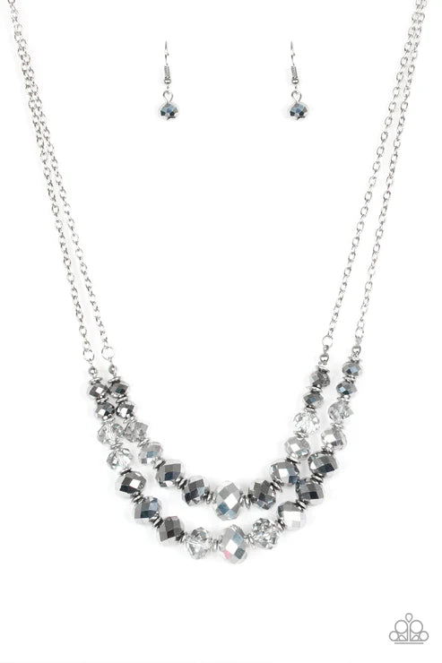 Necklace and earrings set with beaded design on a white background