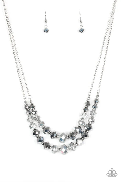 Necklace and earrings set with beaded design on a white background