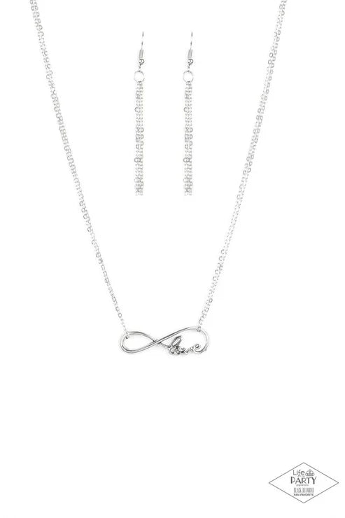Silver infinity necklace on a white background