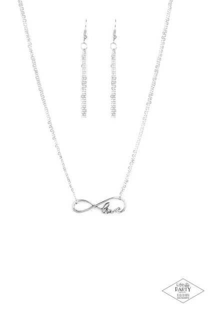 Silver infinity necklace on a white background