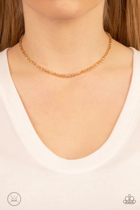 Necklace on a model with a white top