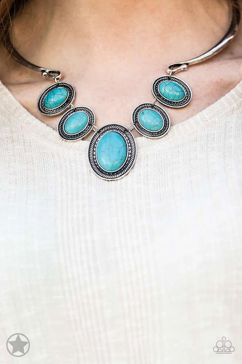 Turquoise necklace with silver accents on a white background