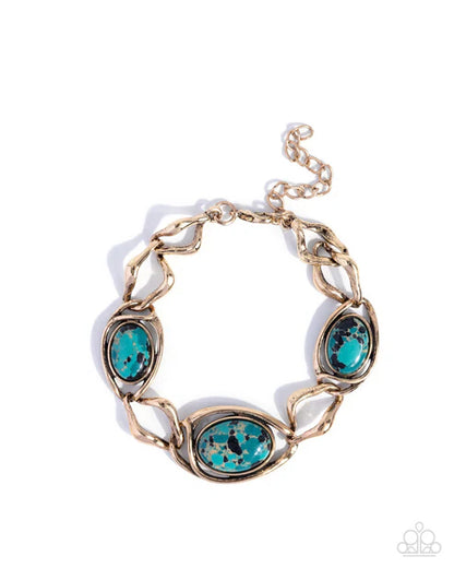 A gold-tone chain bracelet featuring three oval turquoise-blue stone settings, displayed on a clean white background.