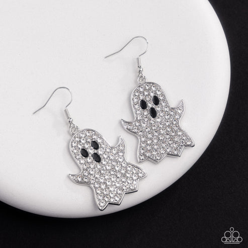 Ghost-shaped earrings with rhinestone details on a white plate