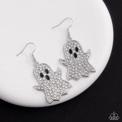Ghost-shaped earrings with rhinestone details on a white plate
