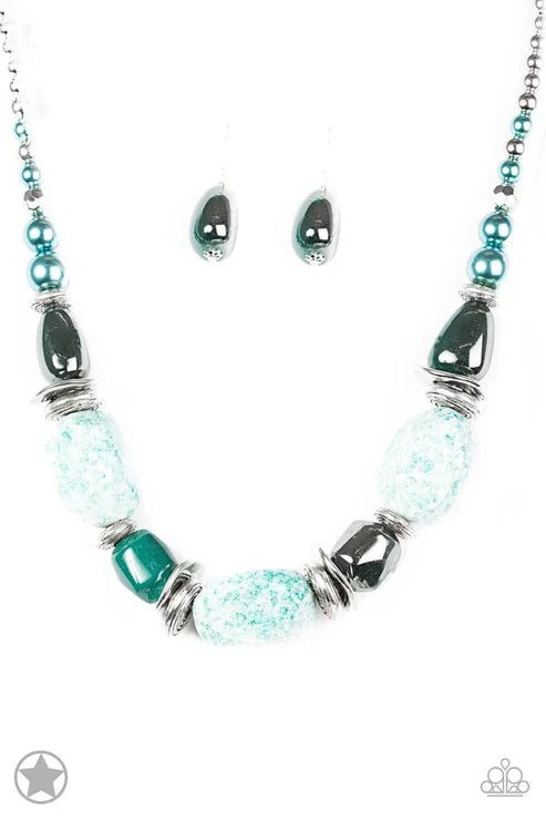 Turquoise and silver beaded necklace and earrings on a white background