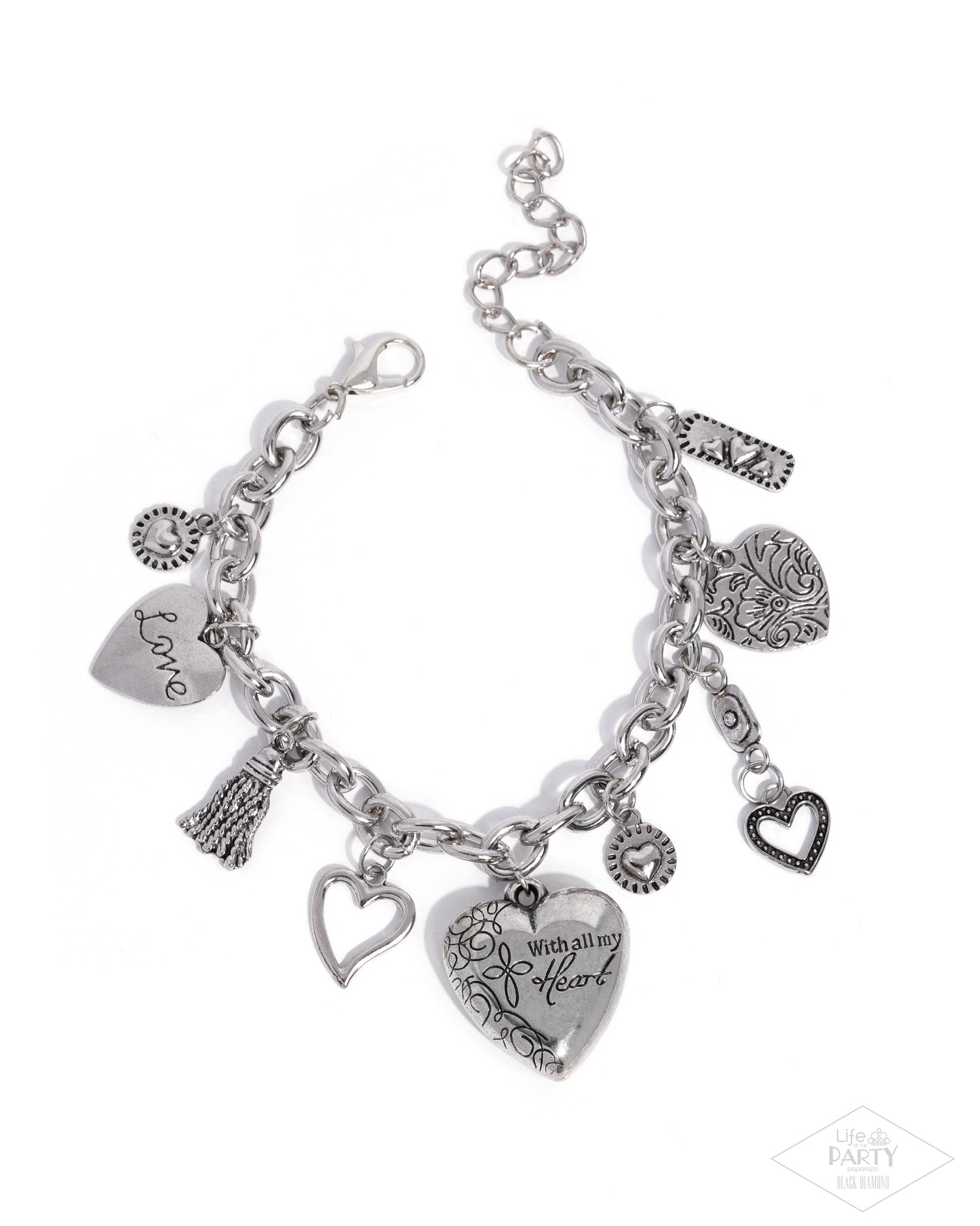 Silver charm bracelet with various charms on a white background
