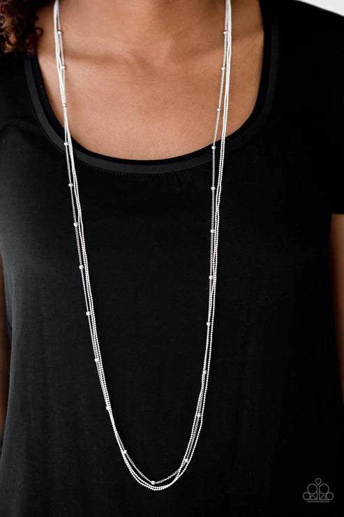 Silver necklace on a black shirt