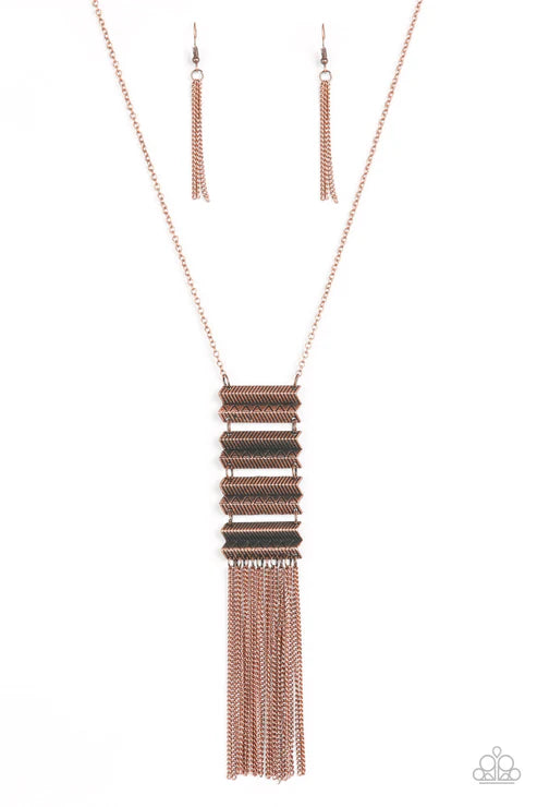 Rose gold fringe necklace and earrings on a white background