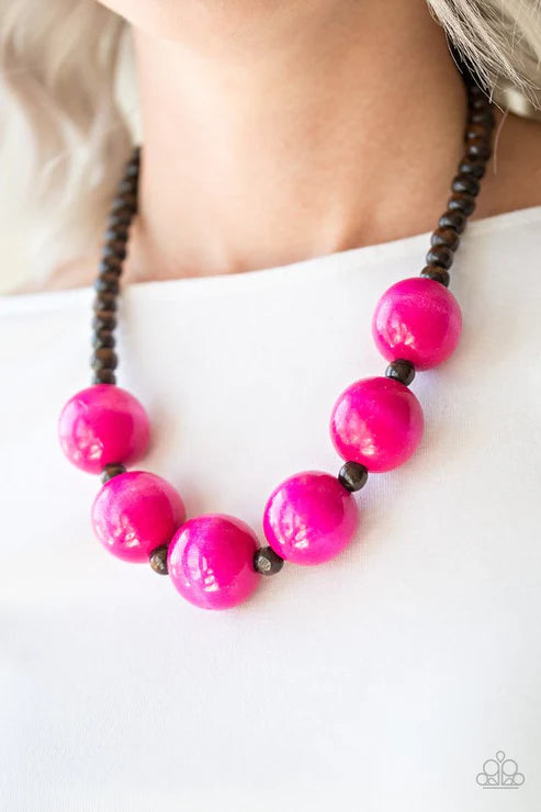 Necklace with pink beads and black accents on a white background
