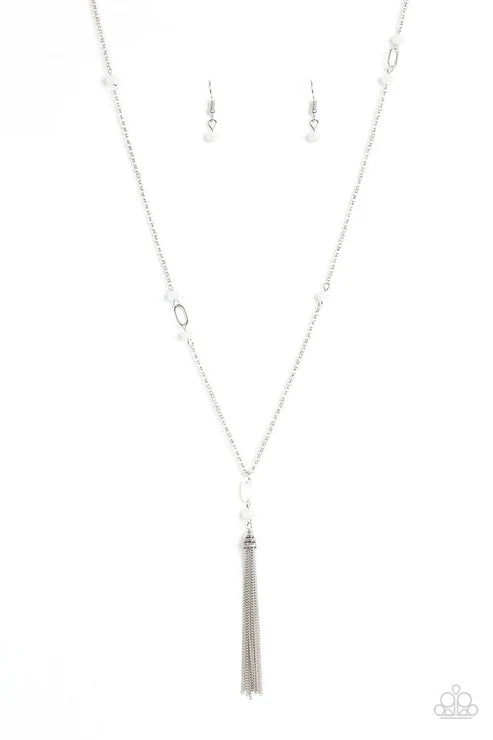 Silver tassel necklace on a white background