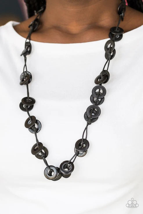 Black button necklace on a white background