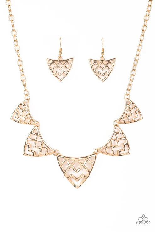 Rose gold necklace and earrings set on a white background
