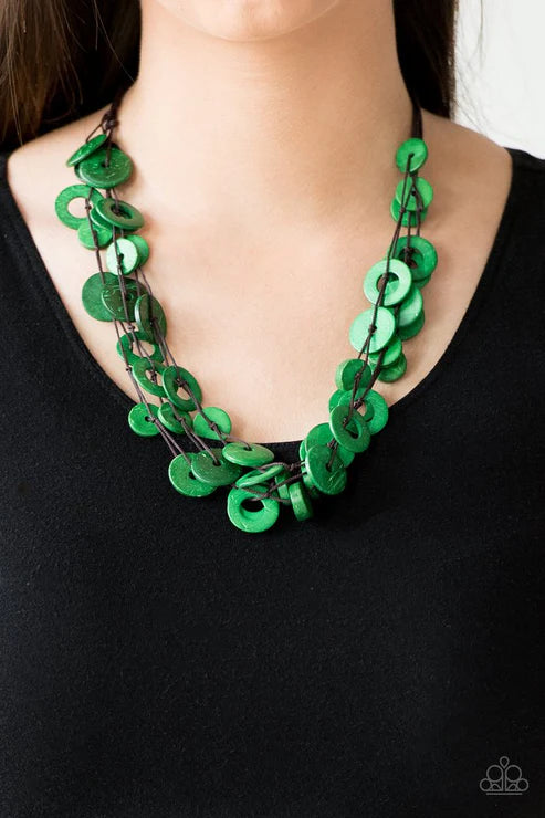 Green chain necklace on a black background
