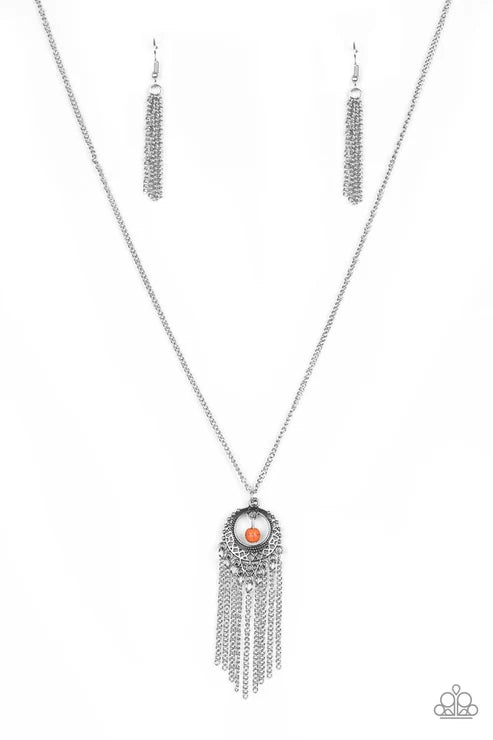 Necklace with fringe and central pendant on a white background