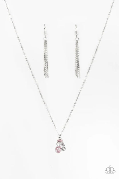 Silver necklace with a pink pendant on a white background