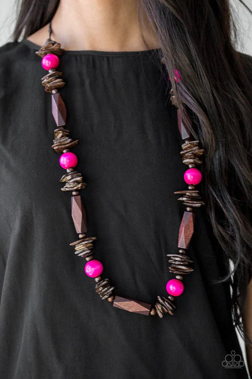 Necklace with pink and brown beads on a black background