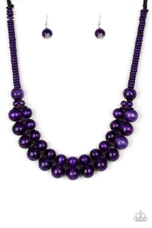 Purple beaded necklace and earrings on a white background