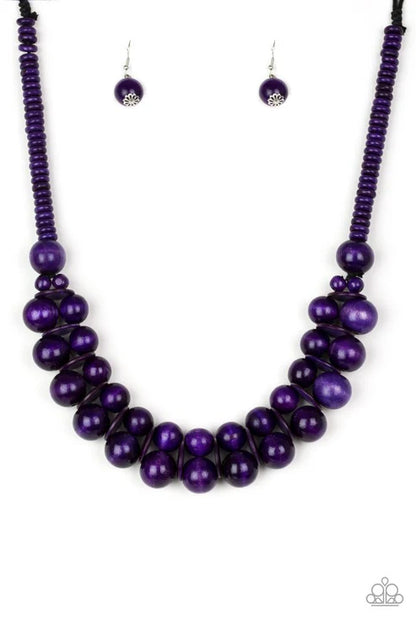 Purple beaded necklace and earrings on a white background