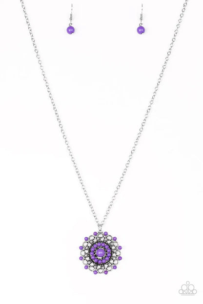 Necklace with purple pendant and matching earrings on a white background