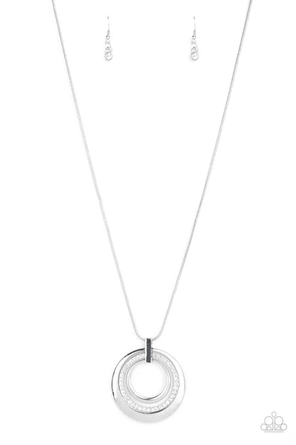 Silver necklace with a circular pendant on a white background