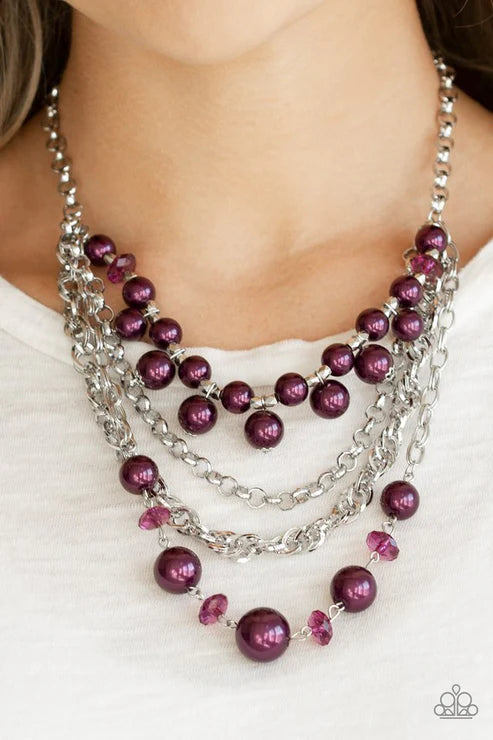 Necklace with purple beads and silver chains on a white background