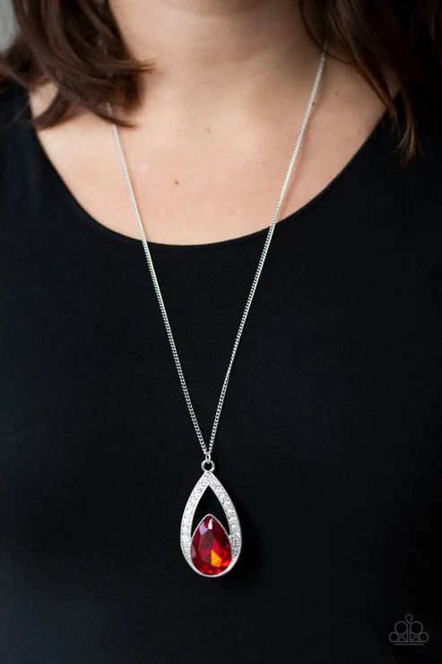 Necklace with a red teardrop pendant on a black background