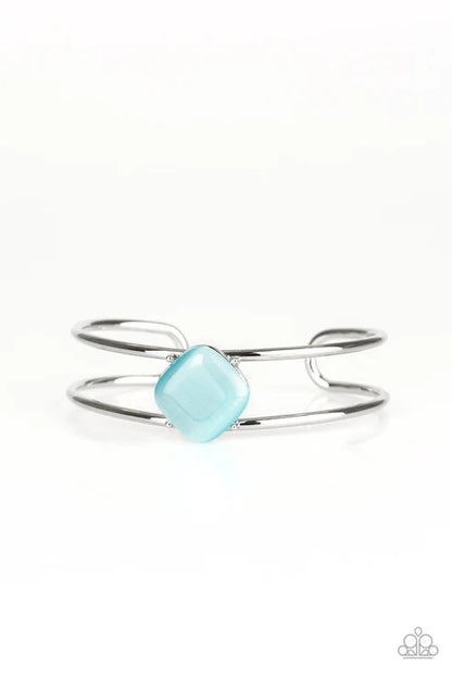 Silver ring with a turquoise gemstone on a white background