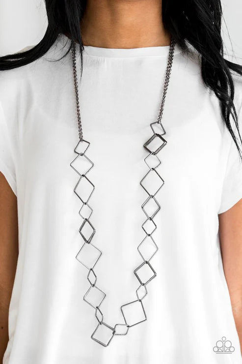 Long necklace with geometric design on a white background