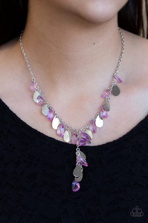 Necklace with pink and silver beads on a black background
