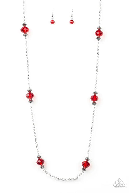 Necklace with red beads on a white background