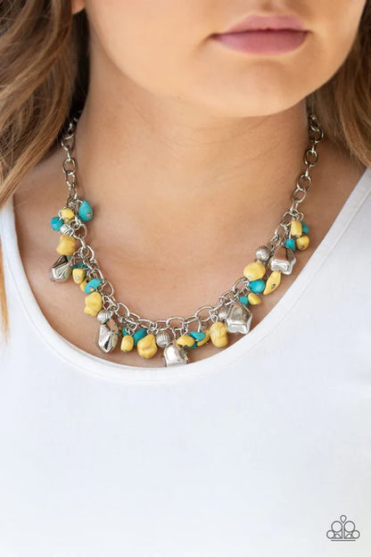 Necklace with yellow and blue beads on a white background