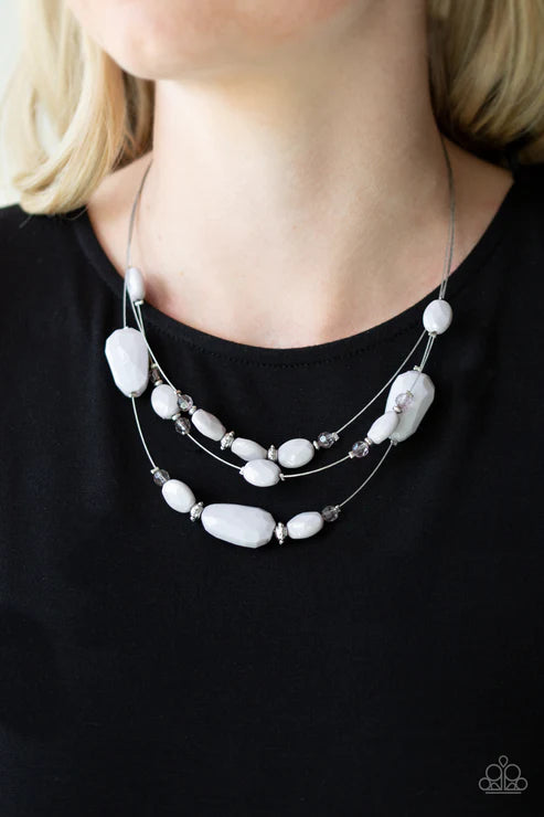 Necklace with white beads and black background