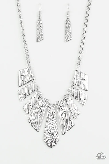 Silver necklace with geometric design on a white background