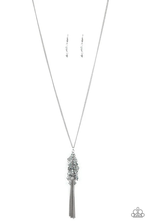 Silver necklace with a tassel pendant on a white background
