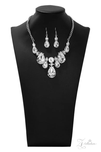 Jewelry set with necklace and earrings on a black mannequin bust.