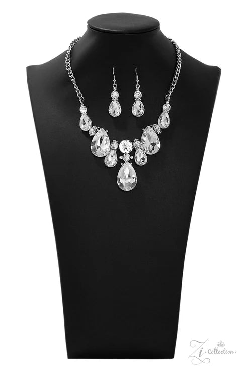 Jewelry set with necklace and earrings on a black mannequin bust.