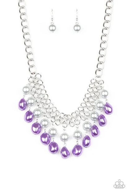 Necklace with purple and silver beads on a white background