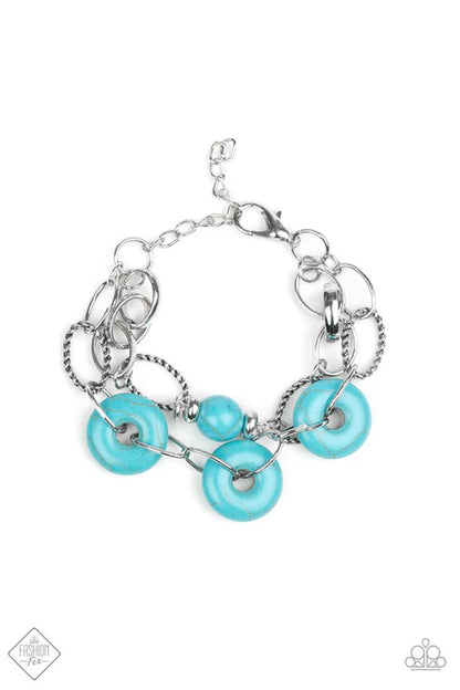Silver bracelet with turquoise beads on a white background