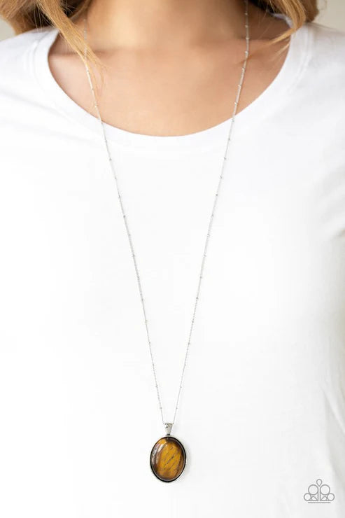 Necklace with a brown pendant on a white background