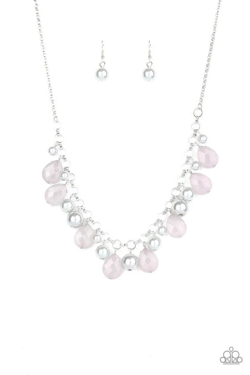 Necklace with pink and clear beads on a white background