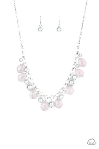Necklace with pink and clear beads on a white background
