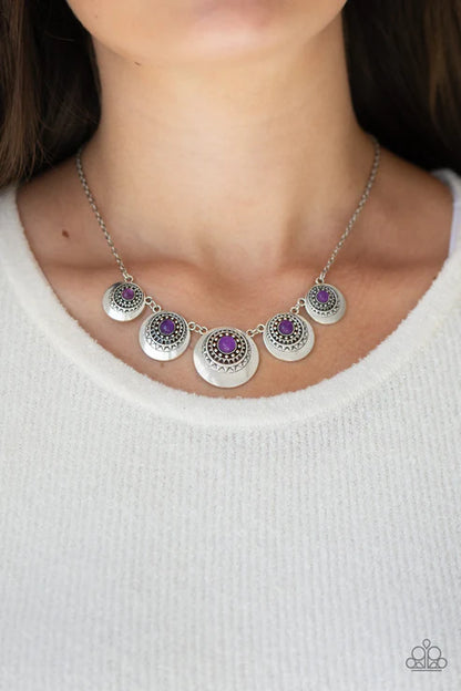 Necklace with circular pendants on a white background