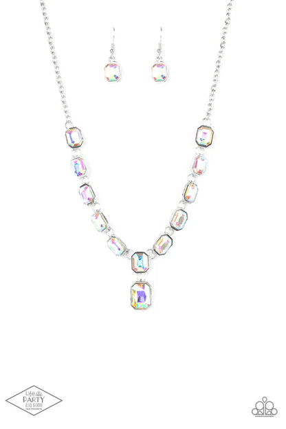 Necklace and earrings set with multicolored gemstones on a white background