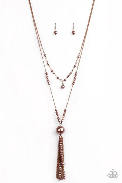 Rose gold necklace and earring set on a white background