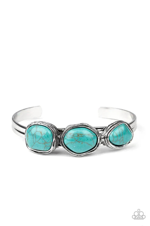 Silver bracelet with turquoise stones on a white background